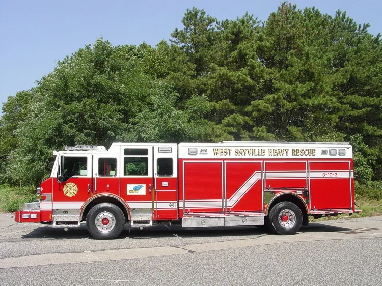 Driver-side full profile showing long rescue body compartments and wheel layout.