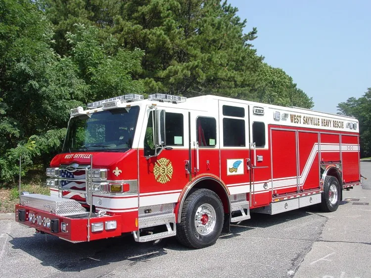 Front-left wide view showing the heavy rescue cab face, side body, and rear compartment section.