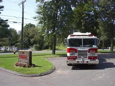 Front exterior view showing grille, bumper, and warning lights