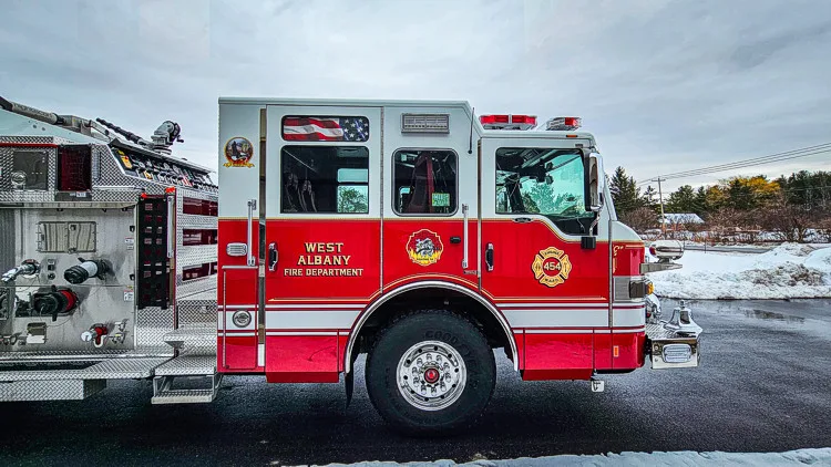 Driver-side profile showing cab and side body near pump panel