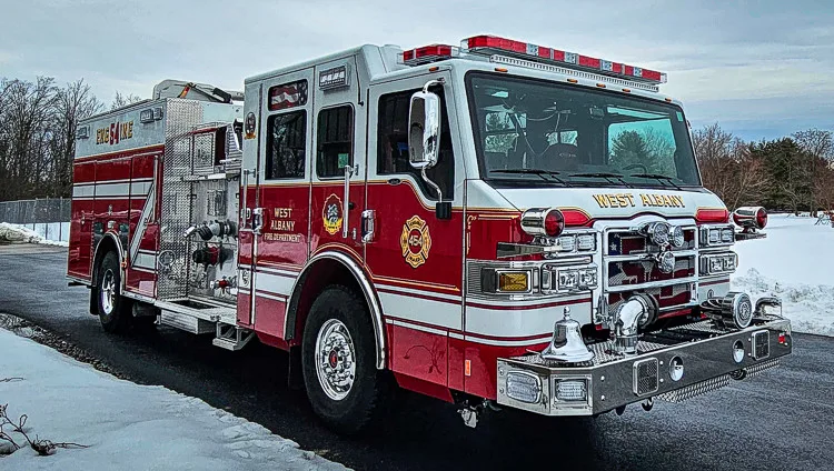 Front-left exterior profile showing pumper cab and side compartments