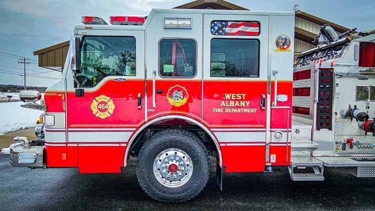 Driver-side profile close-up showing cab and pump panel area