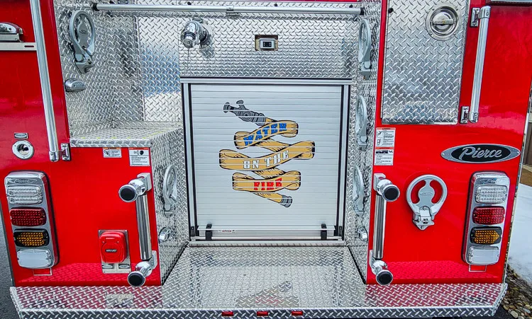 Rear center panel close-up showing emblem and rear fittings