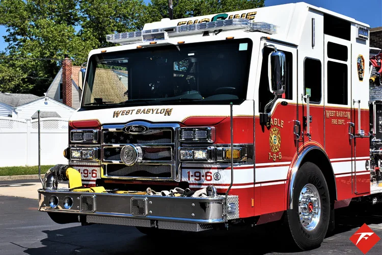 Front-left close view showing grille, bumper, and cab corner