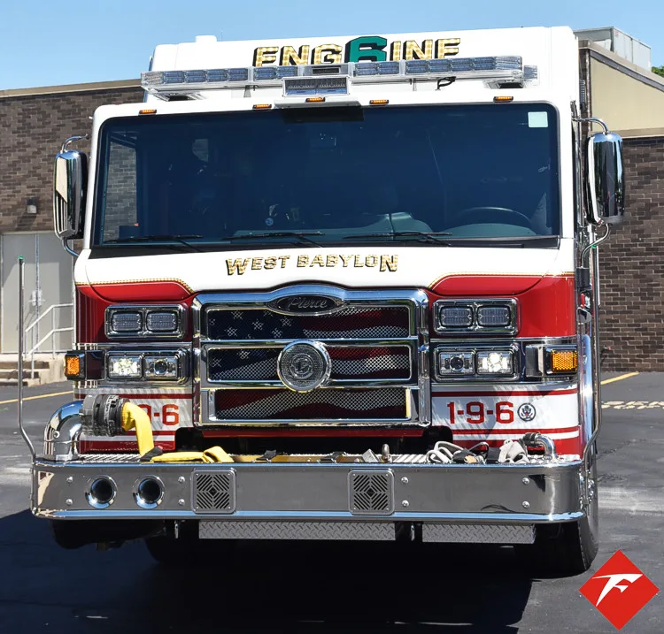 Front exterior view showing grille, bumper, and warning lights