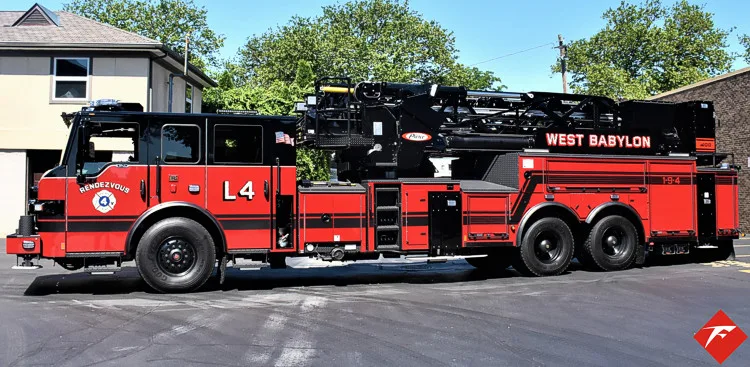 Driver-side full profile showing long wheelbase and ladder bed