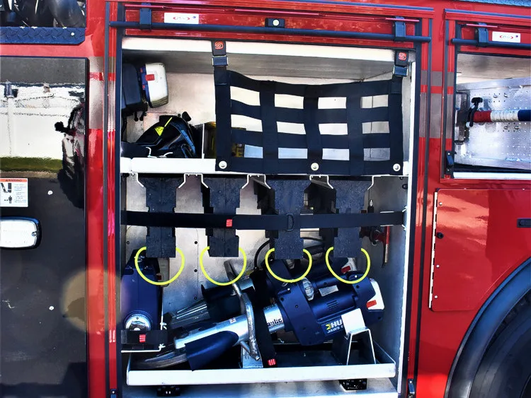 Open side compartment showing mounted SCBA packs and storage rack