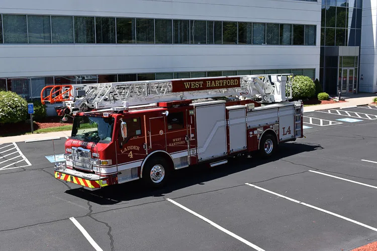 Tower ladder truck side profile view showing full apparatus length