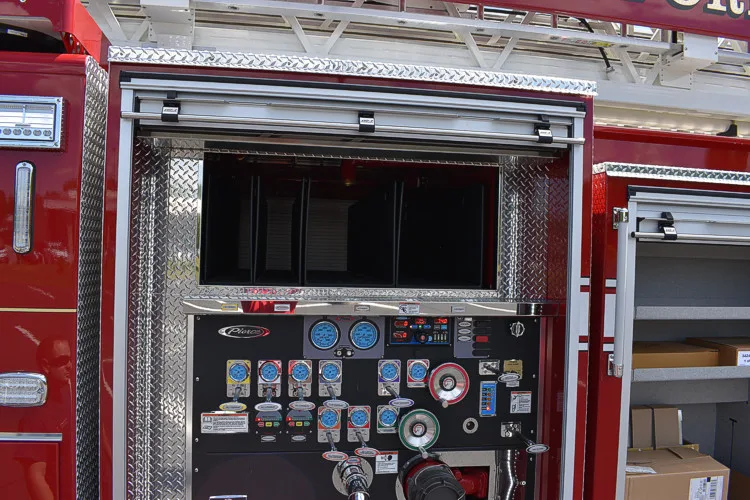Pump-side control panel close-up with gauges and lever controls