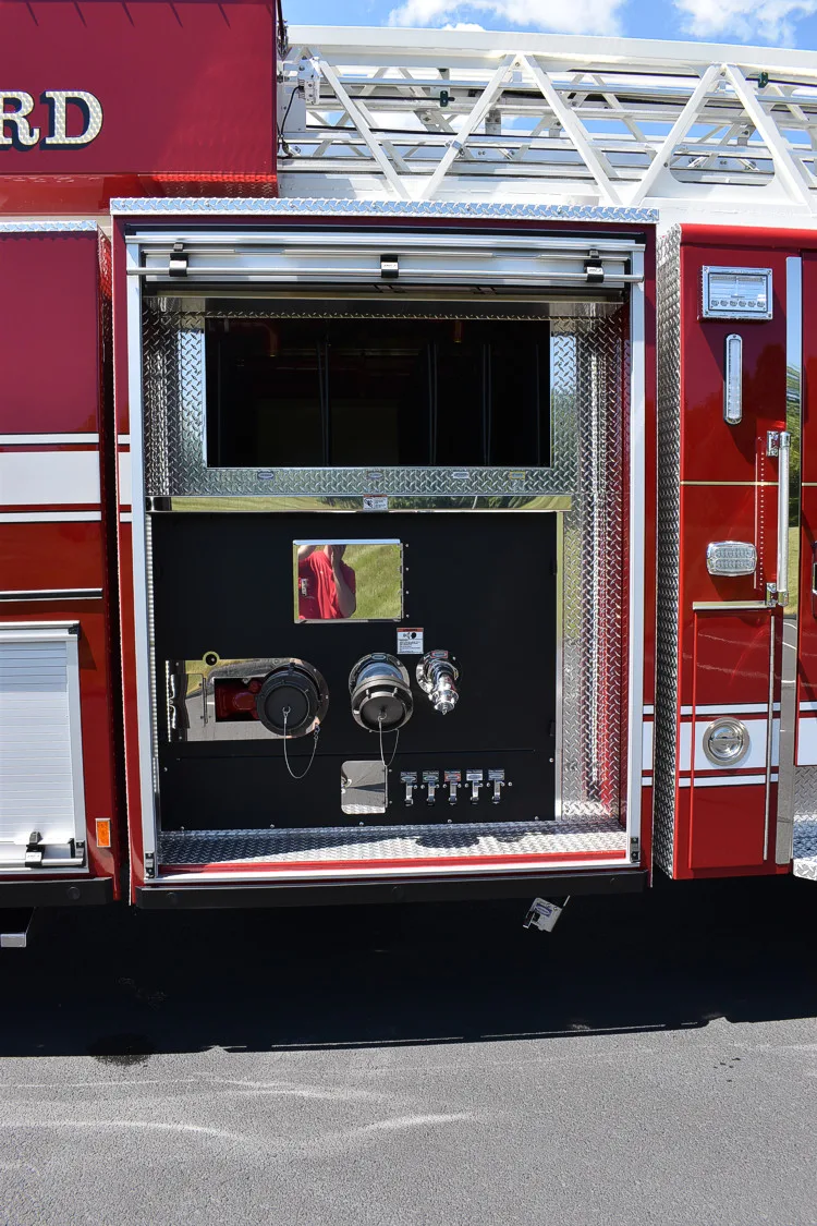 Open side compartment showing slide-out tray and interior storage bay