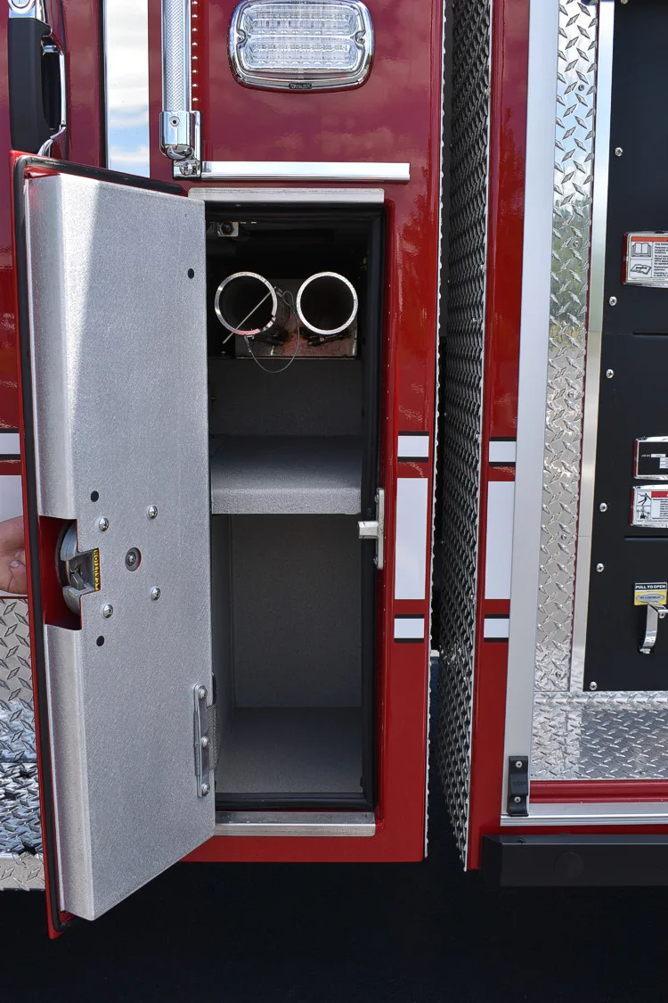 Open narrow side compartment showing upright storage bay and fittings