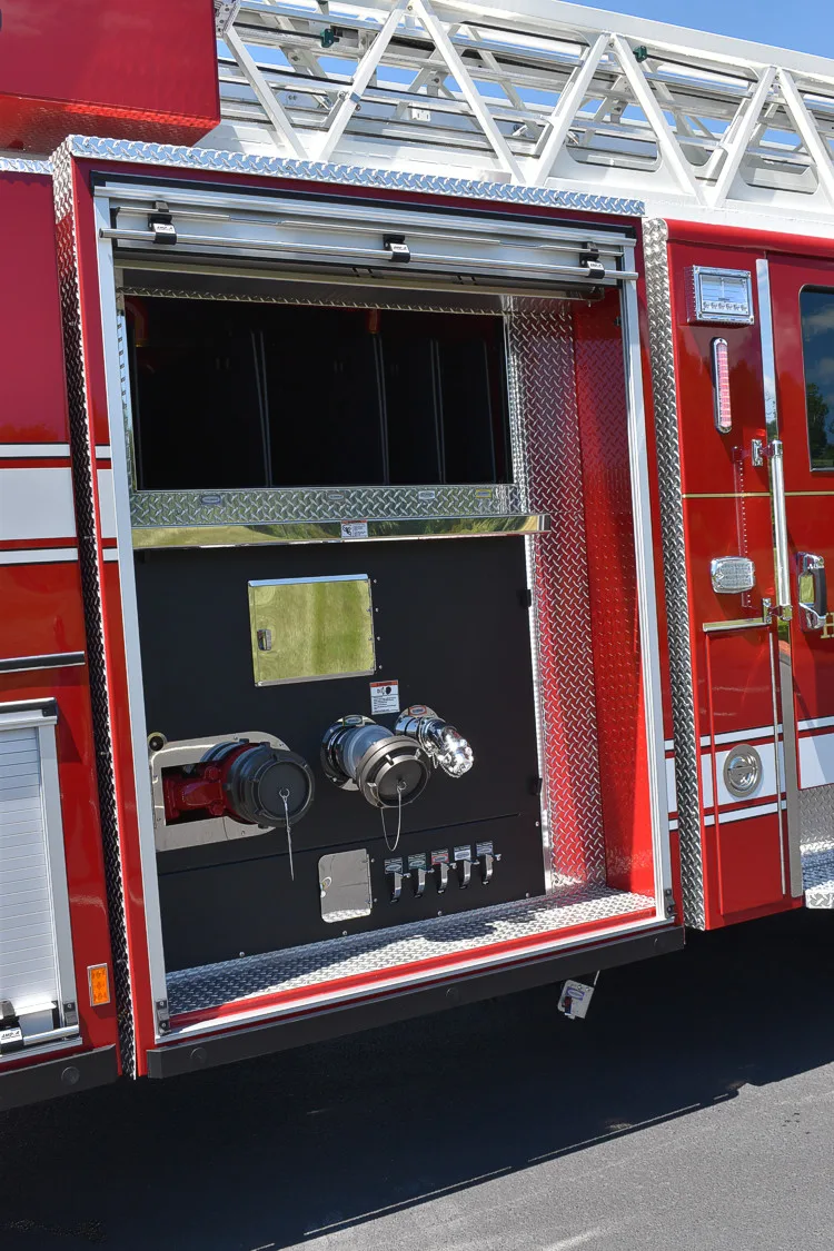 Open side compartment showing control panel, gauge cluster, and lower tray