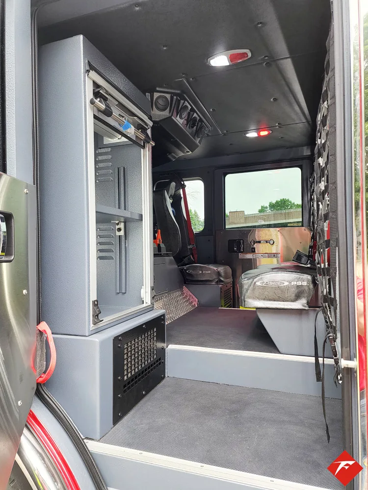 Rear cab door open view showing stepwell and interior walkway