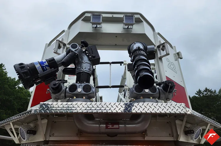 Ladder tip close-up showing bucket platform with mounted nozzles