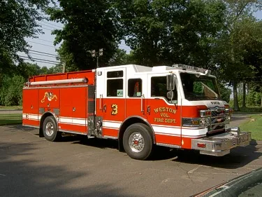 Front-right exterior view showing bumper, cab, and side compartments