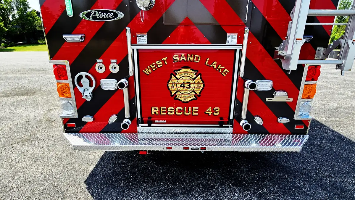 Rear body close-up showing chevrons and lower rear compartment area