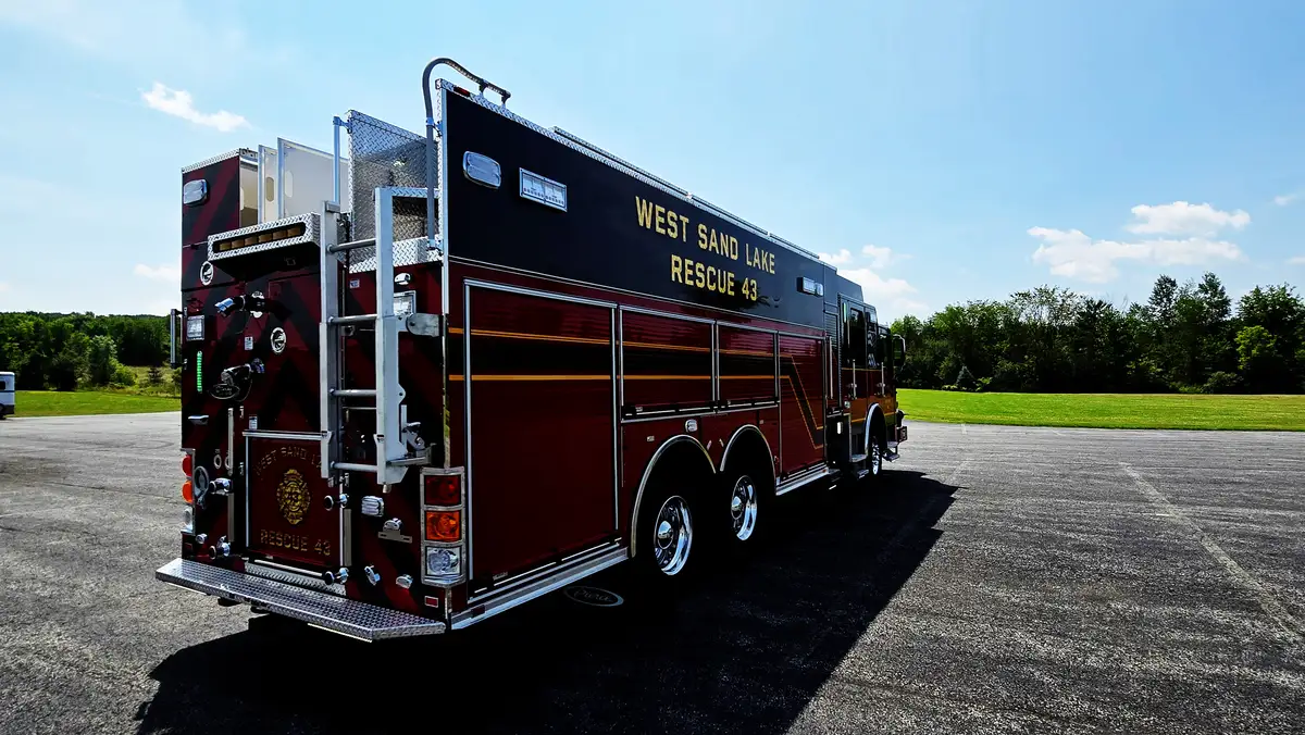 Rear-right exterior view showing side body and compartment layout