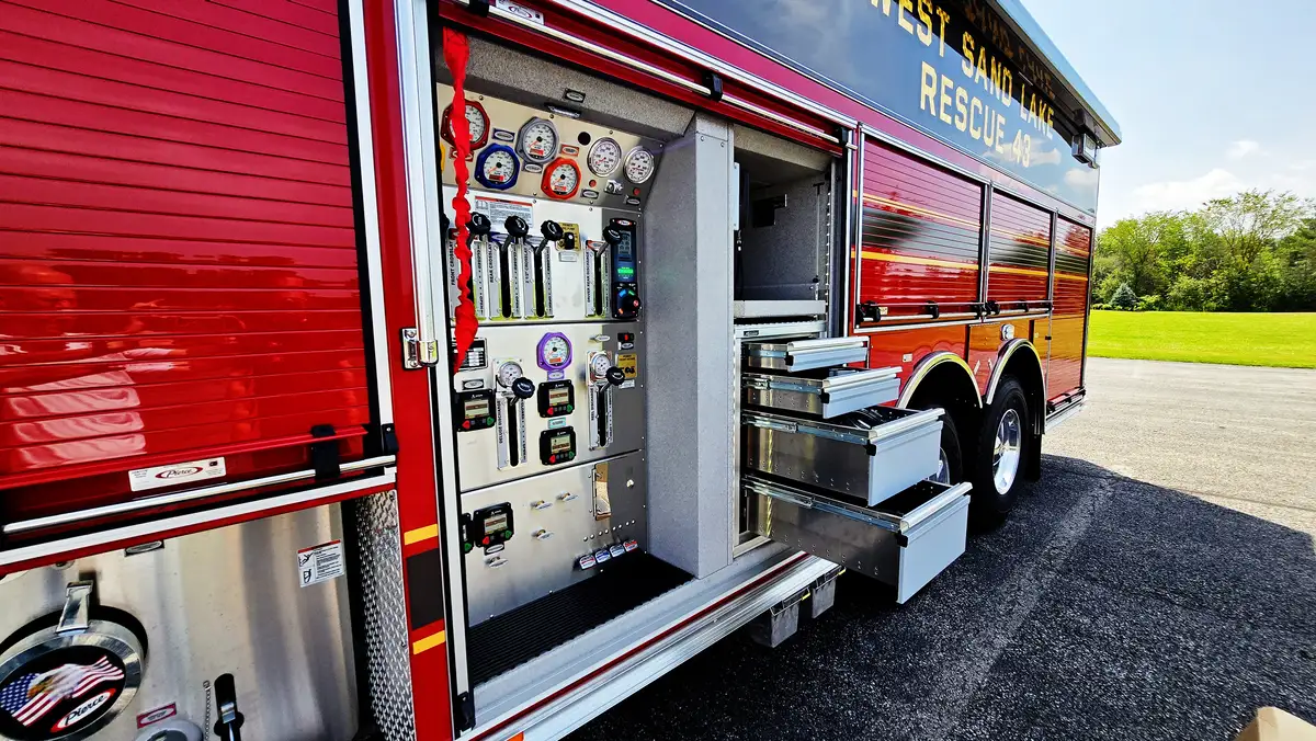 Open side compartment showing pump controls and connection panel
