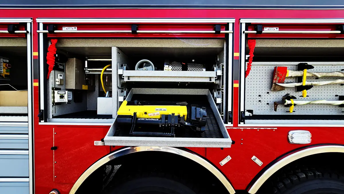 Open side compartment showing generator unit and tool storage
