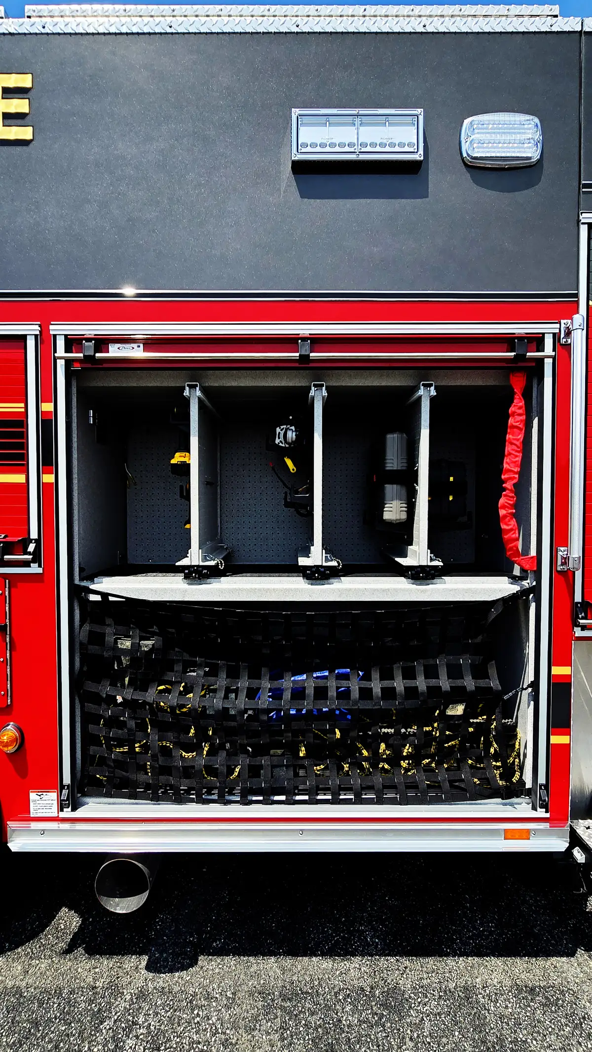 Open rear compartment showing slide-in tray rack storage