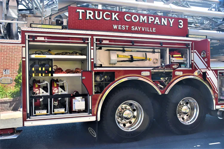 Open side compartment showing tool bins and shelf-mounted gear