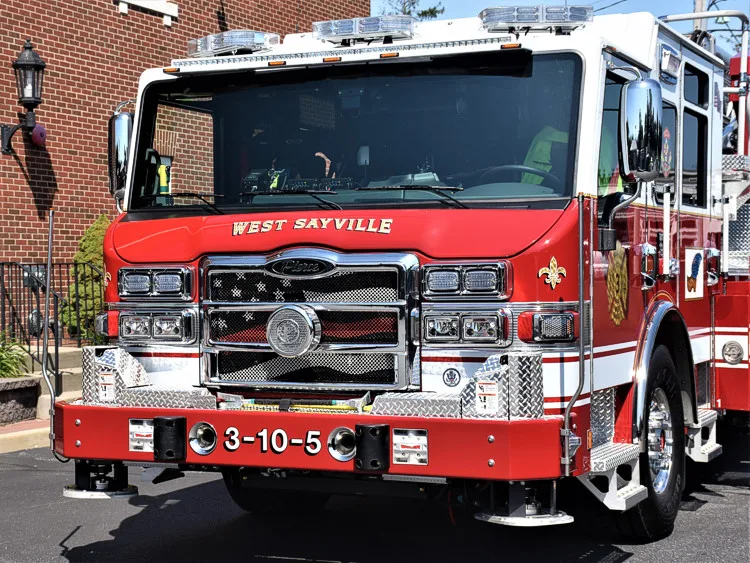 Head-on front view showing grille, bumper, and warning lights