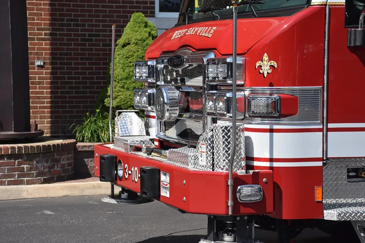 Front bumper close-up showing grille bars, intake ports, and warning lights