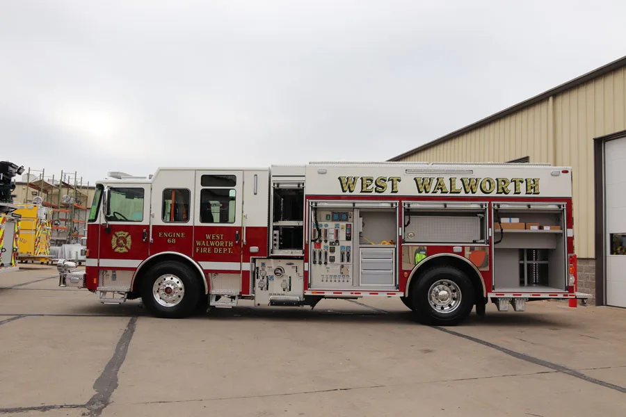 Driver-side full profile showing pumper body and tandem compartment line