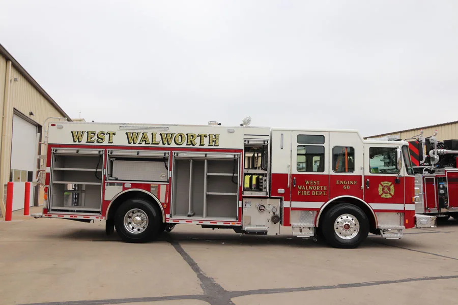 Officer-side profile showing side compartments and rear wheel section