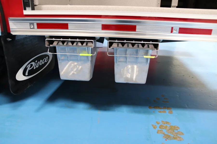 Rear step area close-up showing diamond-plate platform and rear fittings