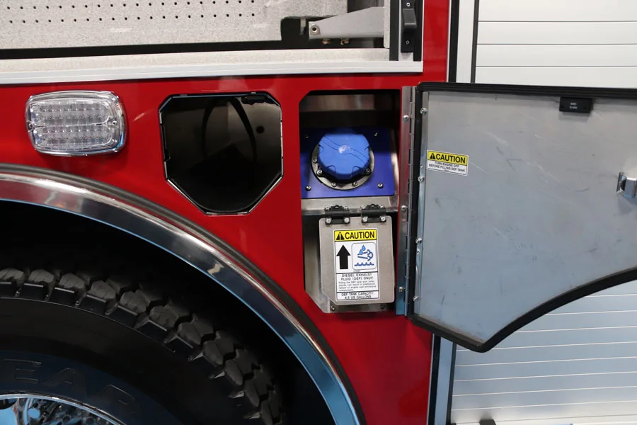 Rear wheel area close-up showing side marker light and intake fitting panel