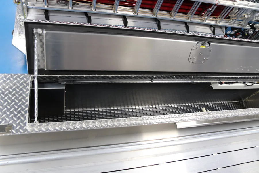 Open long side compartment showing shelf storage and pull-out tray track