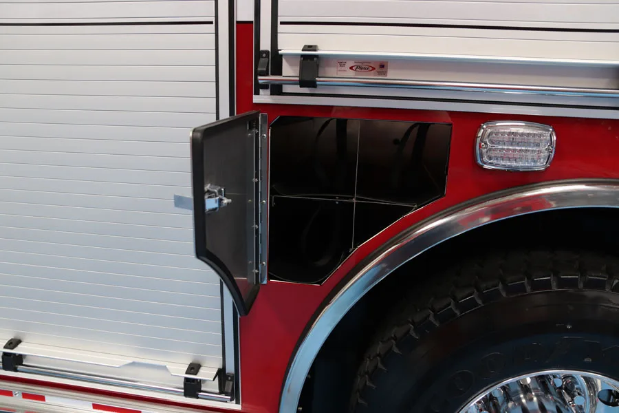 Wheel arch and body corner close-up showing compartment edge and trim