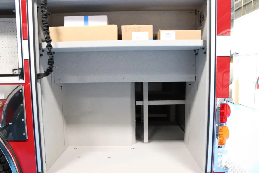 Open side compartment showing clean shelf storage and lower bay opening