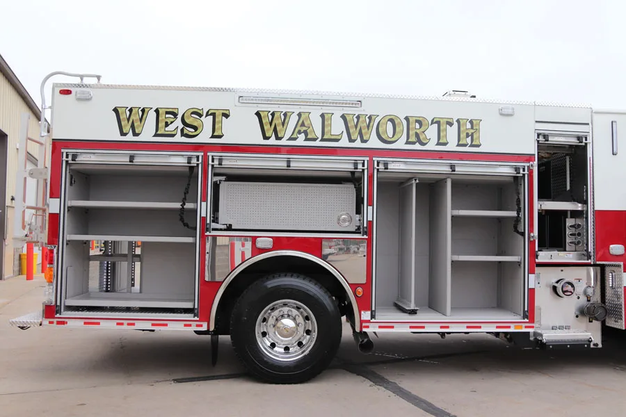 Officer-side profile view with open side compartments and wheel area