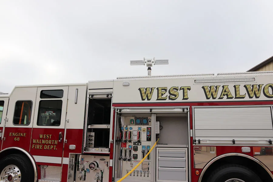Upper body side close-up showing raised lettering panel above compartments