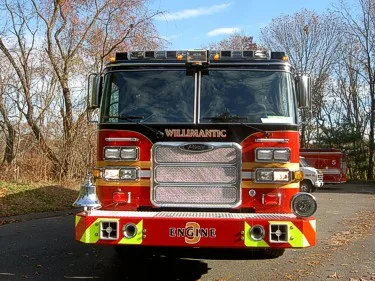 Head-on front view highlighting chrome grille, warning lights, and front bumper fittings.