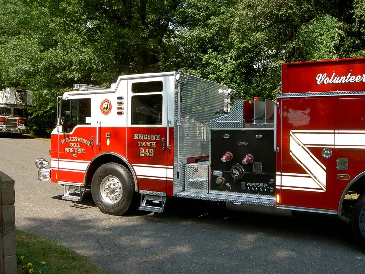 Driver-side profile view showing pump panel area and wheelbase