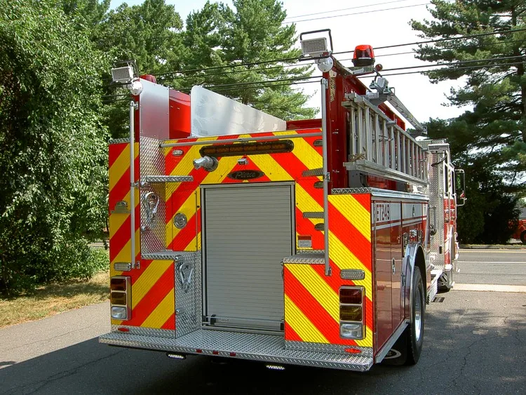 Rear view showing chevrons, rear panel, and warning lights