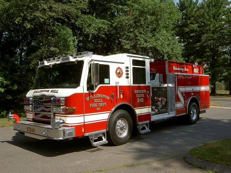 Front-left exterior view showing bumper, cab, and side body