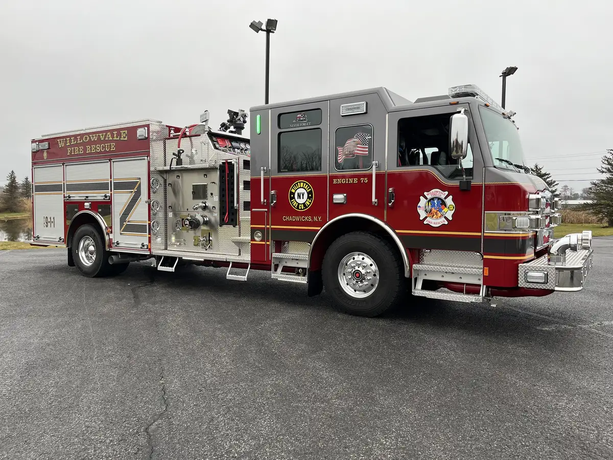 Officer-side profile view showing side pump panel and compartment doors