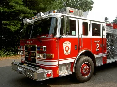 Front-right exterior view showing bumper, grille, and cab corner