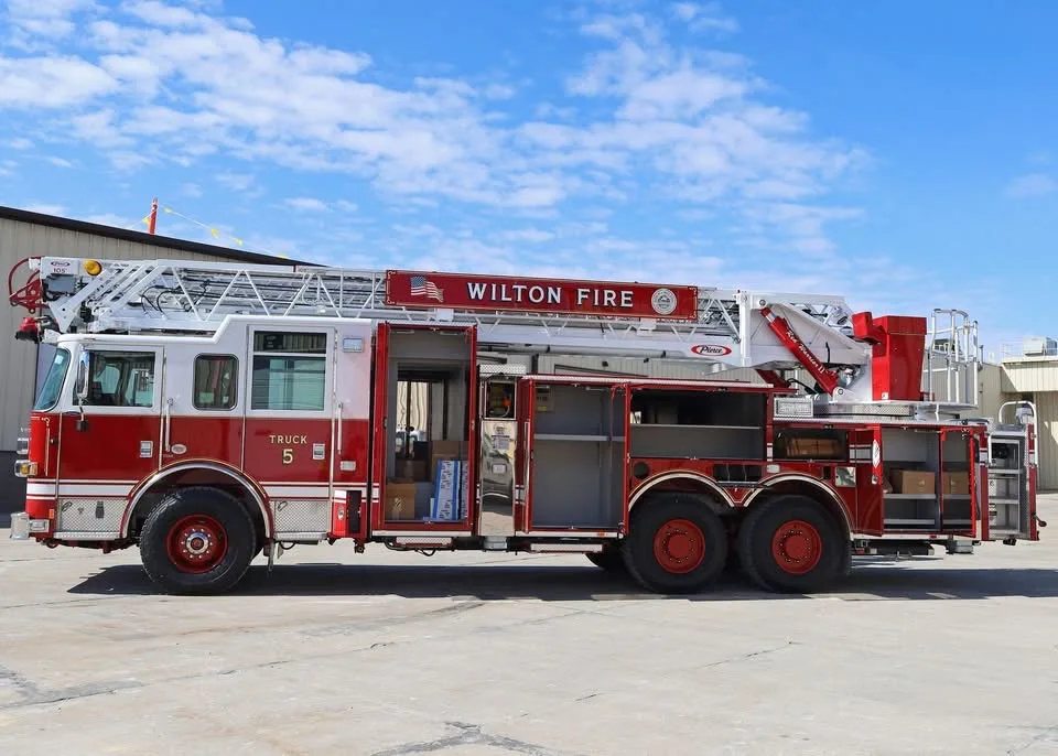 Driver-side profile with open side compartment showing tool bay