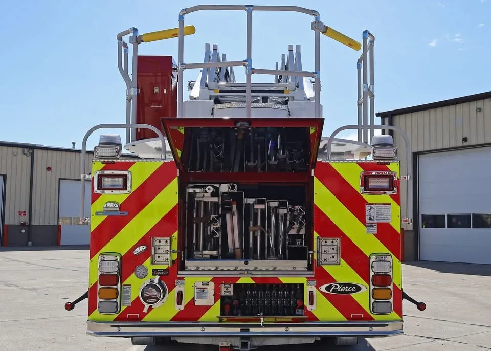 Rear view showing open center rear compartment and ladder rack