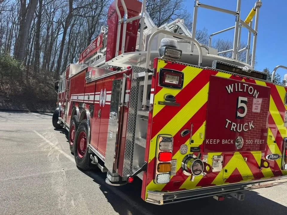 Rear-left exterior view showing side body and rear compartment area