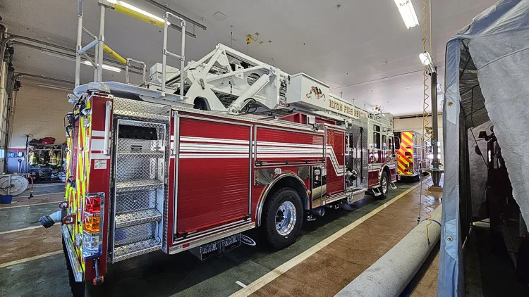 Rear-left exterior view showing side compartments and rear chevrons