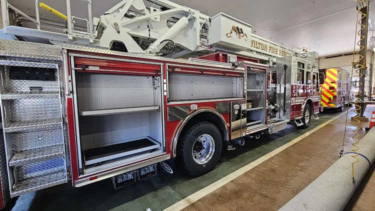 Open side compartment showing long storage bay and shelf space