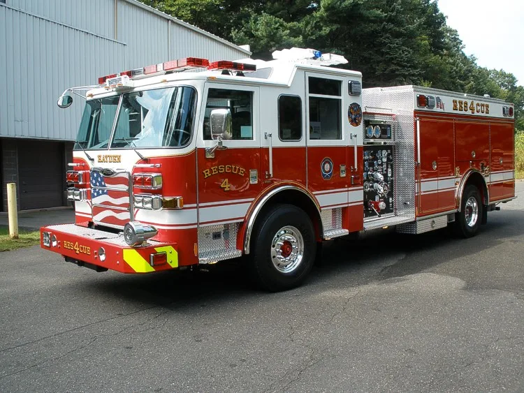 Front-right wide view showing the side pump panel controls and closed side compartments.