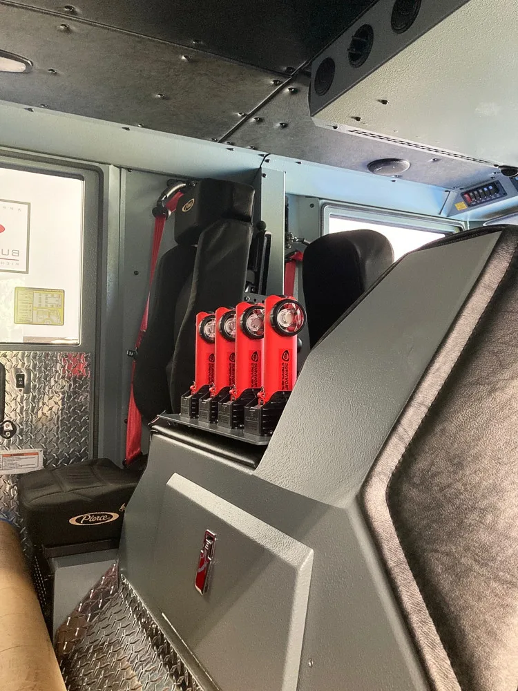 Cab interior side view showing rear seats and center aisle