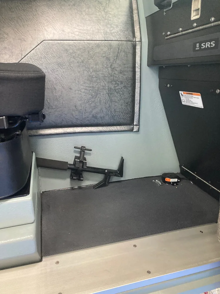 Cab interior close-up showing rear wall panel and side seat area